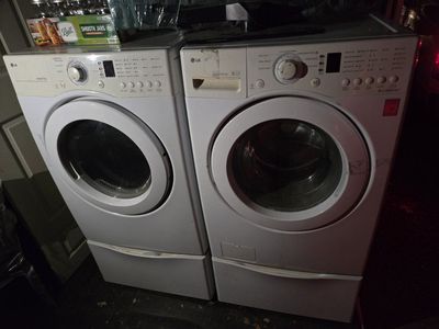 LG TrueBalance Front Load Washer & Dryer with Storage Pedestals – $400