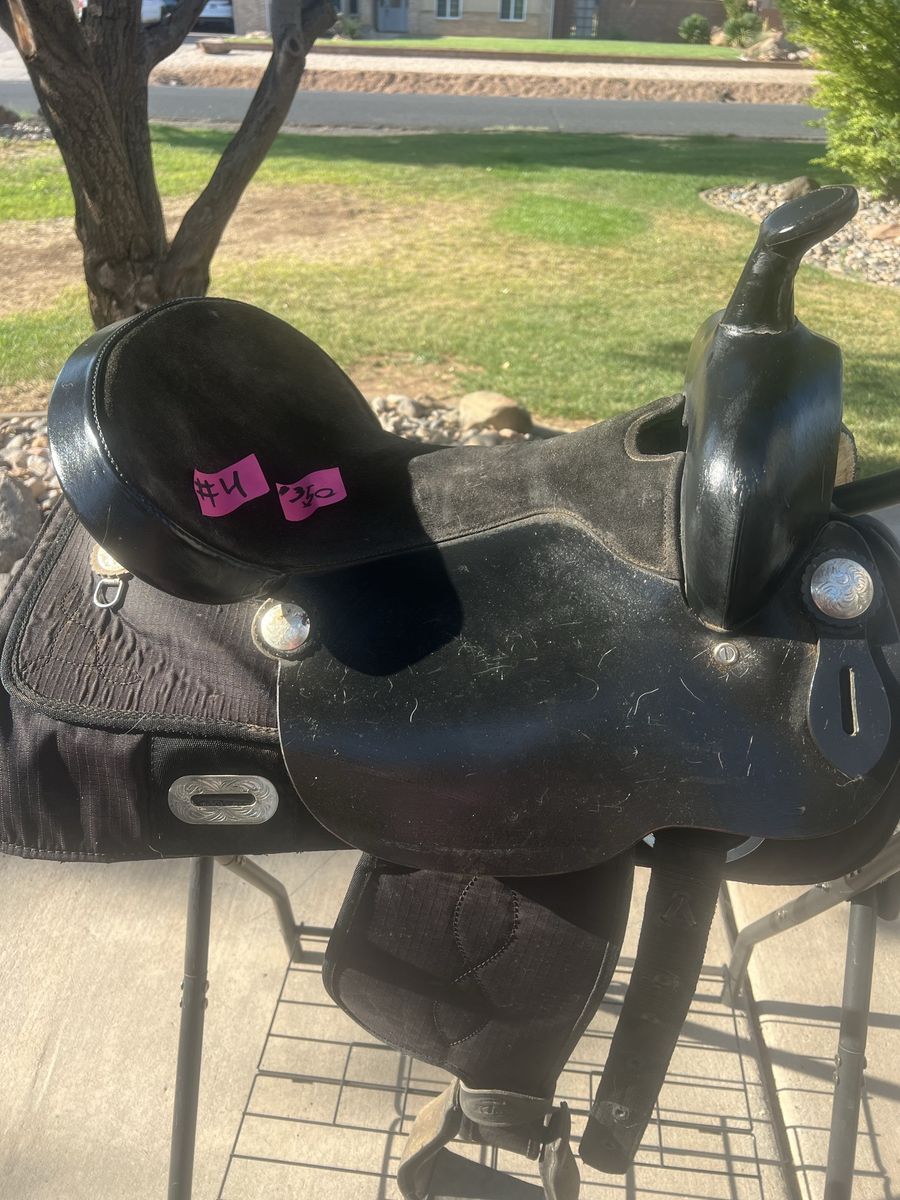 For sale, a lightweight 16-inch black western saddle in good used condition.