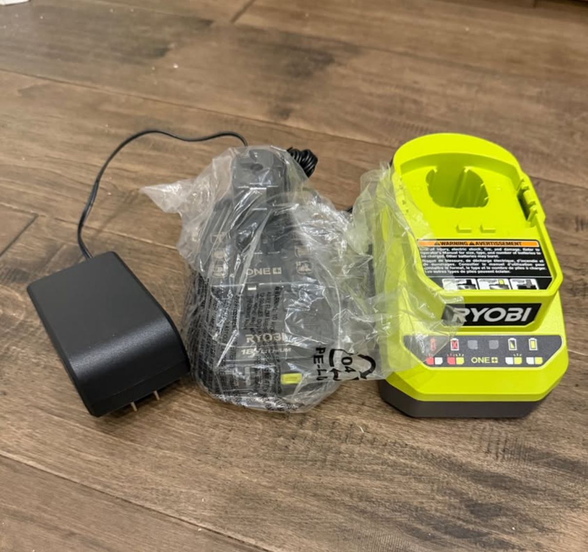 Brand new never used Ryobi Battery + Charger