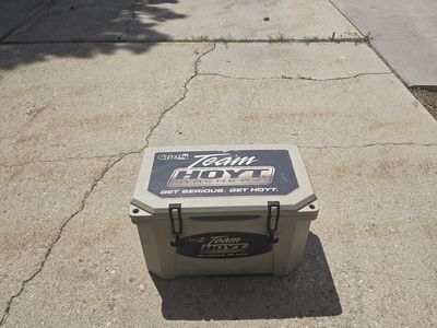 Two coolers, Grizzly 45 team Hoyt archery and an Igloo Maccold premium 62q