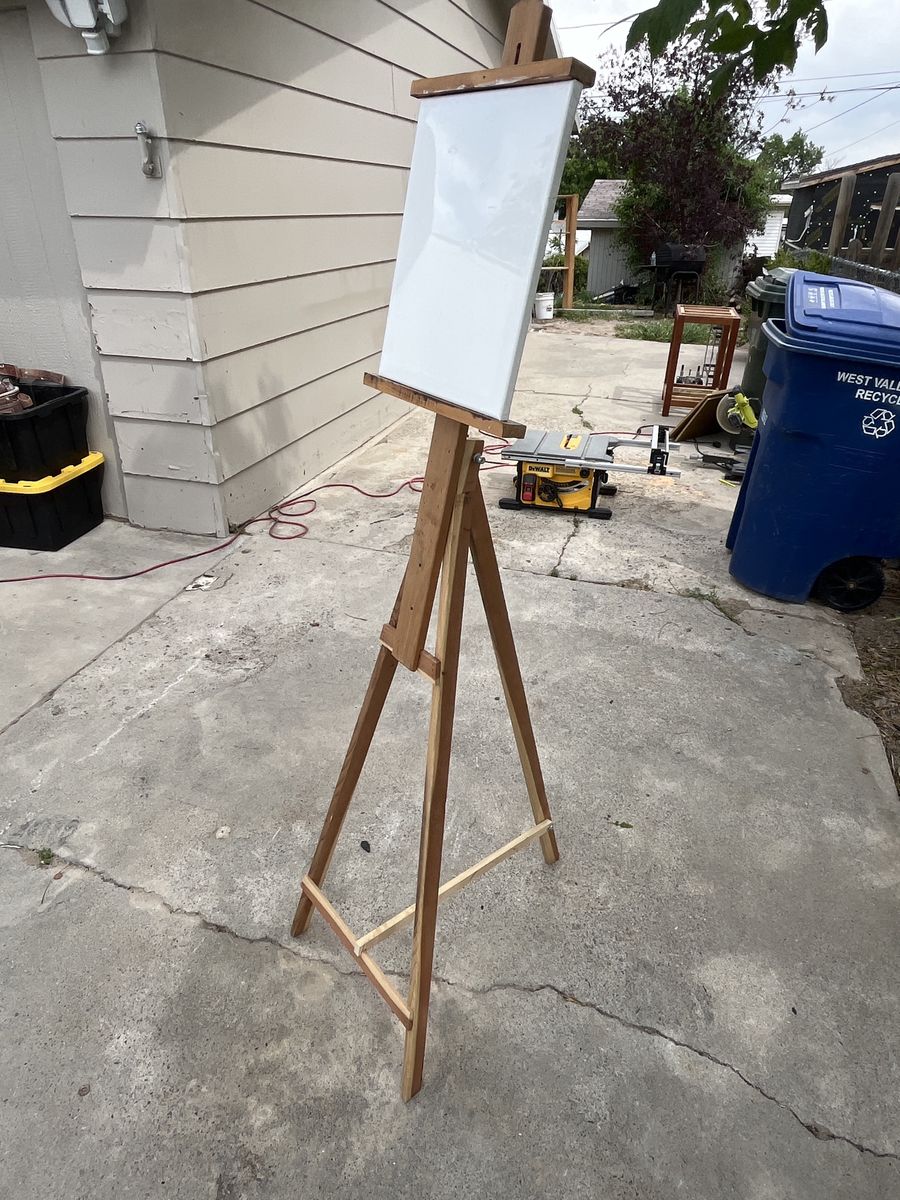 Artists easel and  multiple canvas