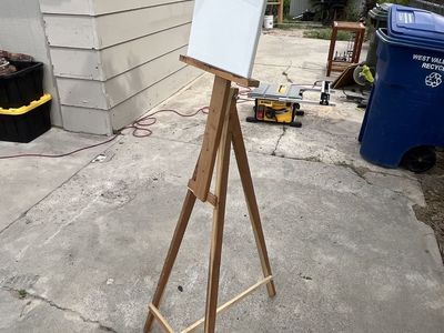 Artists easel and multiple canvas