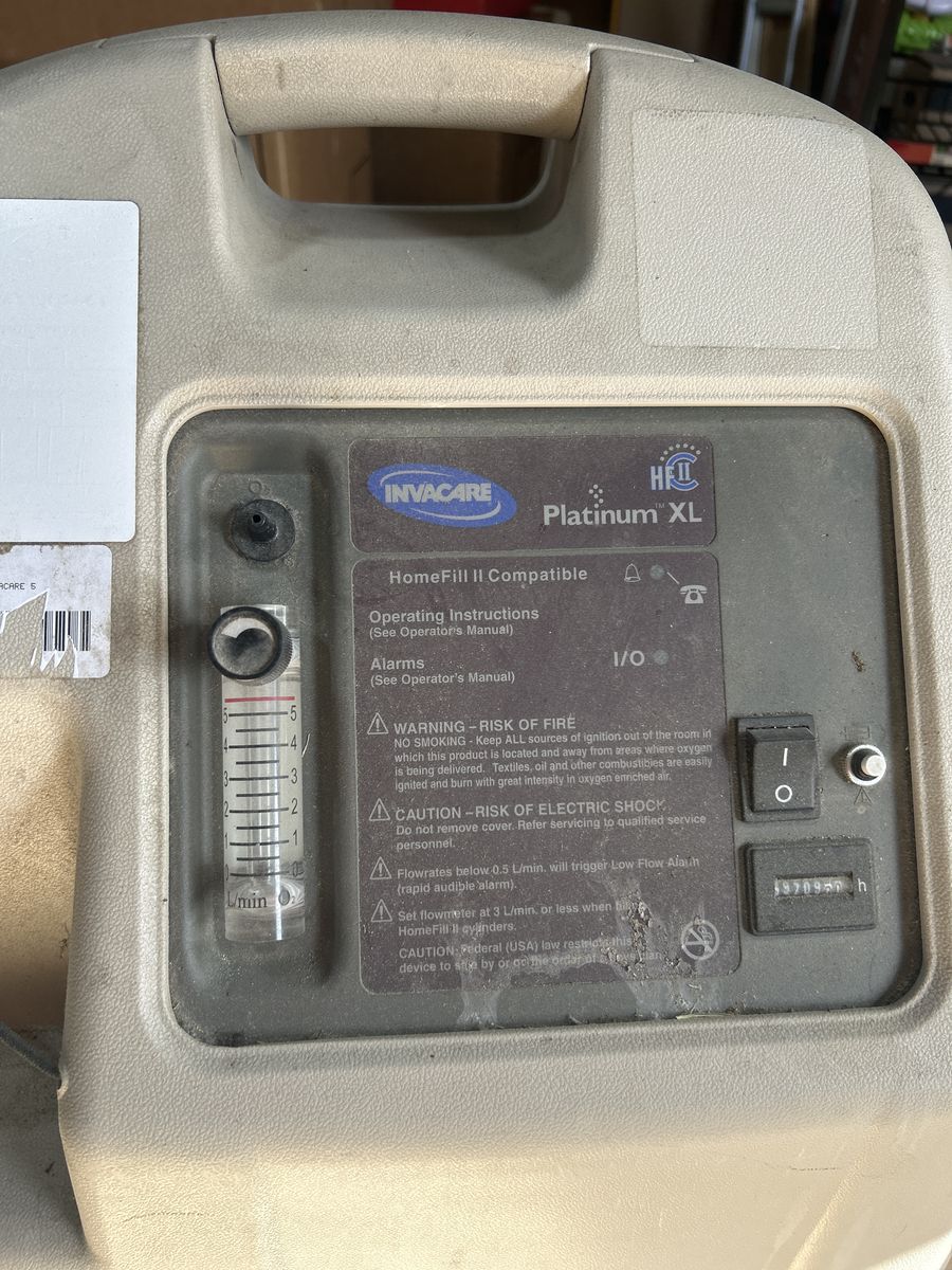 Invacare Platinum XL Homefill Oxygen machine with hose.
