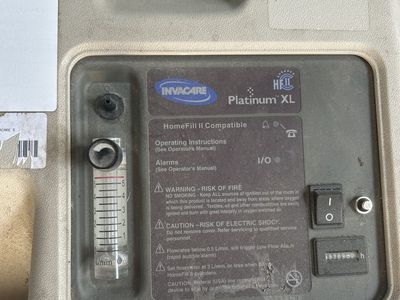 Invacare Platinum XL Homefill Oxygen machine with hose.
