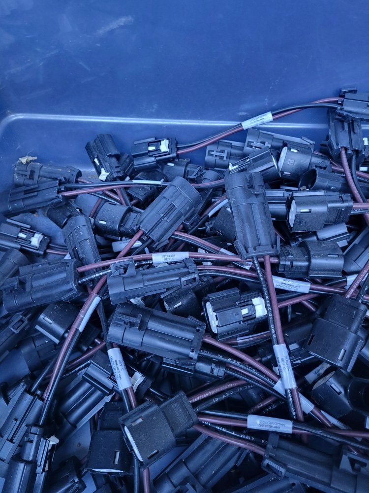 Tote full of Automotive light plugs