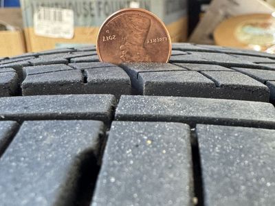 Good used tire, plenty of tread left, no damage.