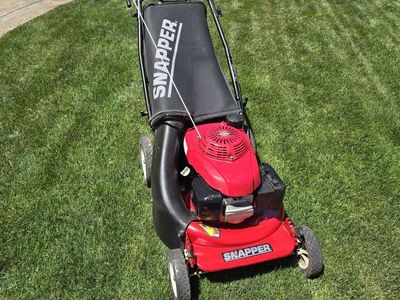 Snapper HiVac self-propelled mower with Honda easy start engine and grass bag.