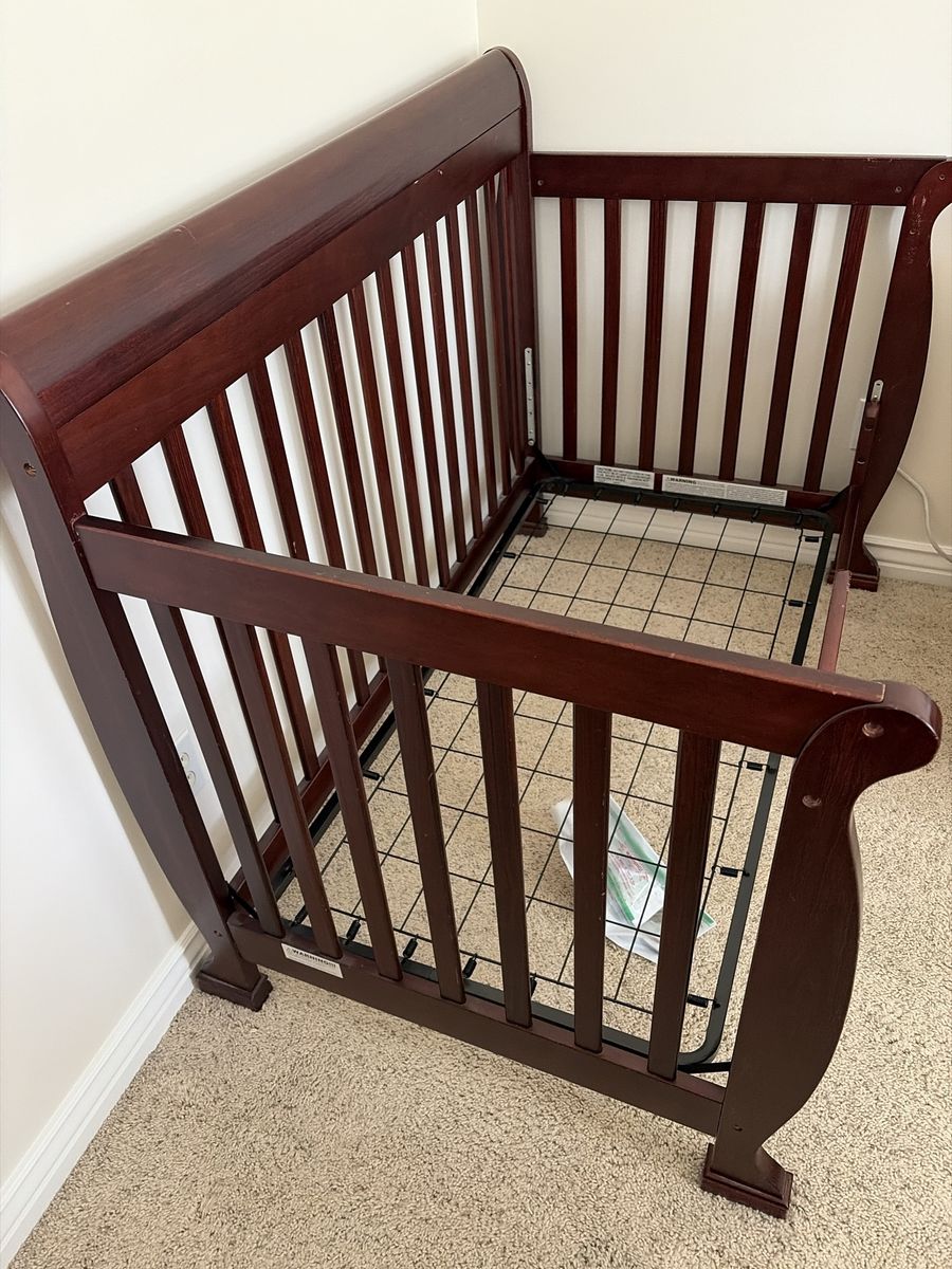Dark Wood Sleigh Crib with Adjustable Mattress Support
