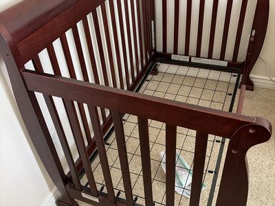 Dark Wood Sleigh Crib with Adjustable Mattress Support