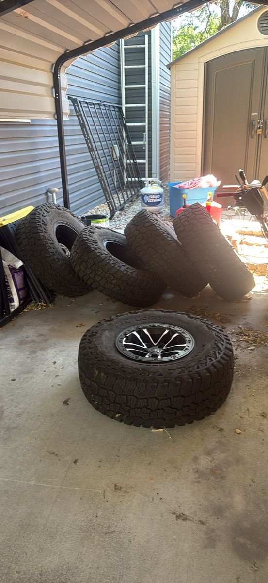 Set of 5 Mickey Thompson Baja Boss A/T 37x12.50R17LT Tires with Black/Machined wheels