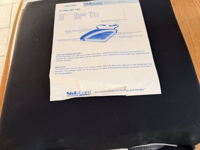 This Skil-Care Econo-Gel Wheelchair Cushion features a black low-shear cover and a two-part gel pod design for pressure relief.