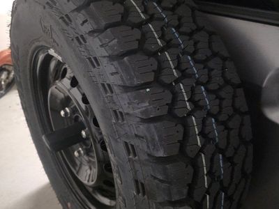 General Grabber A/T Tires with Black Steel Wheels (Bronco Take-offs) - Set of 5 Size 265/70R16