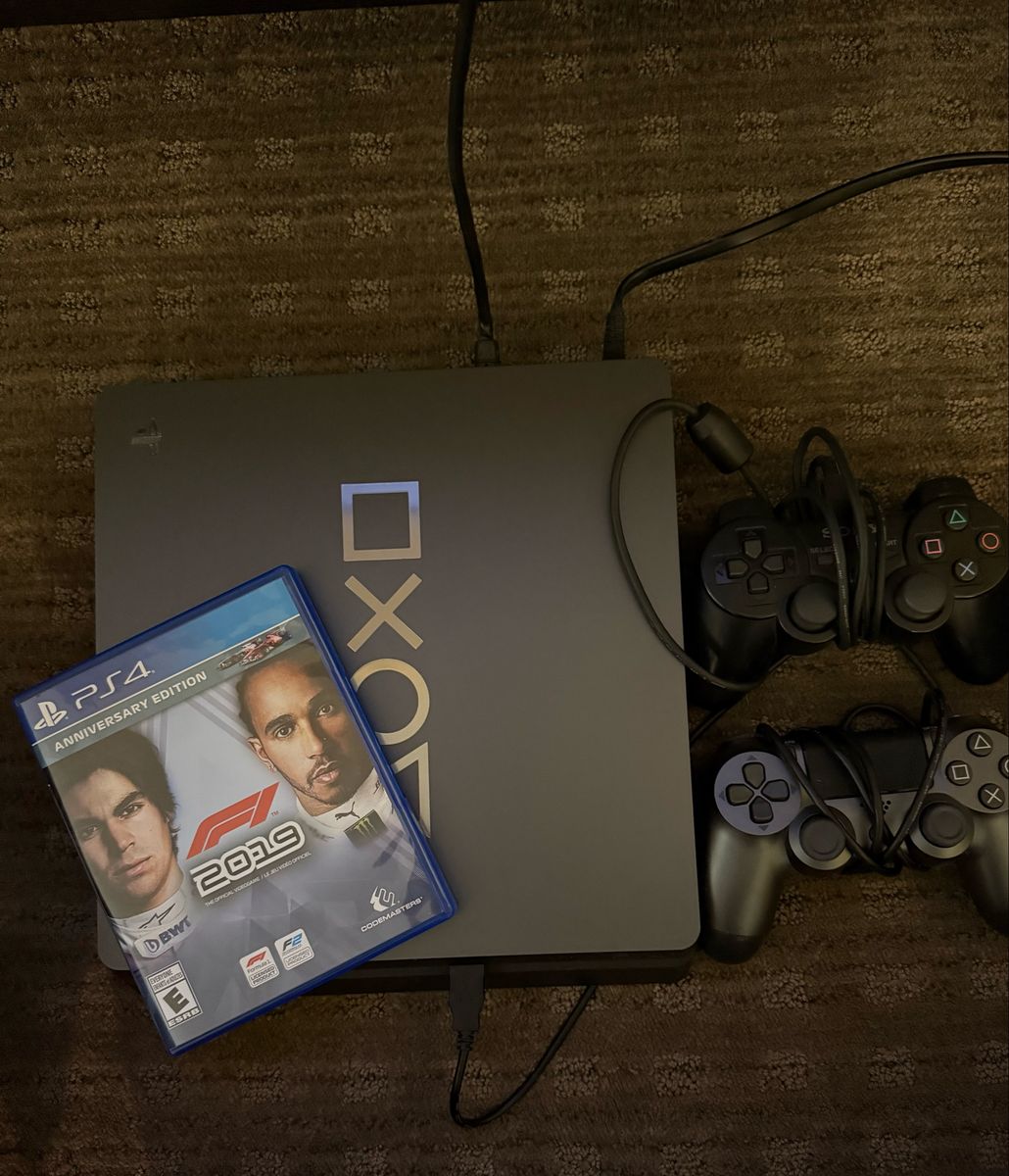 PS4 w/ two controllers and F1 game