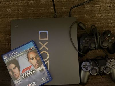 PS4 w/ two controllers and F1 game