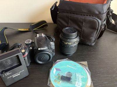 Nikon D3200 DSLR Camera with 18-55mm lens, original software & carrying case