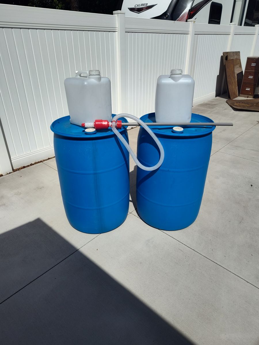 2- 55 Gallon 2-5 Gallon + Syphon Pump $10.00