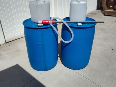 2- 55 Gallon 2-5 Gallon + Syphon Pump $10.00