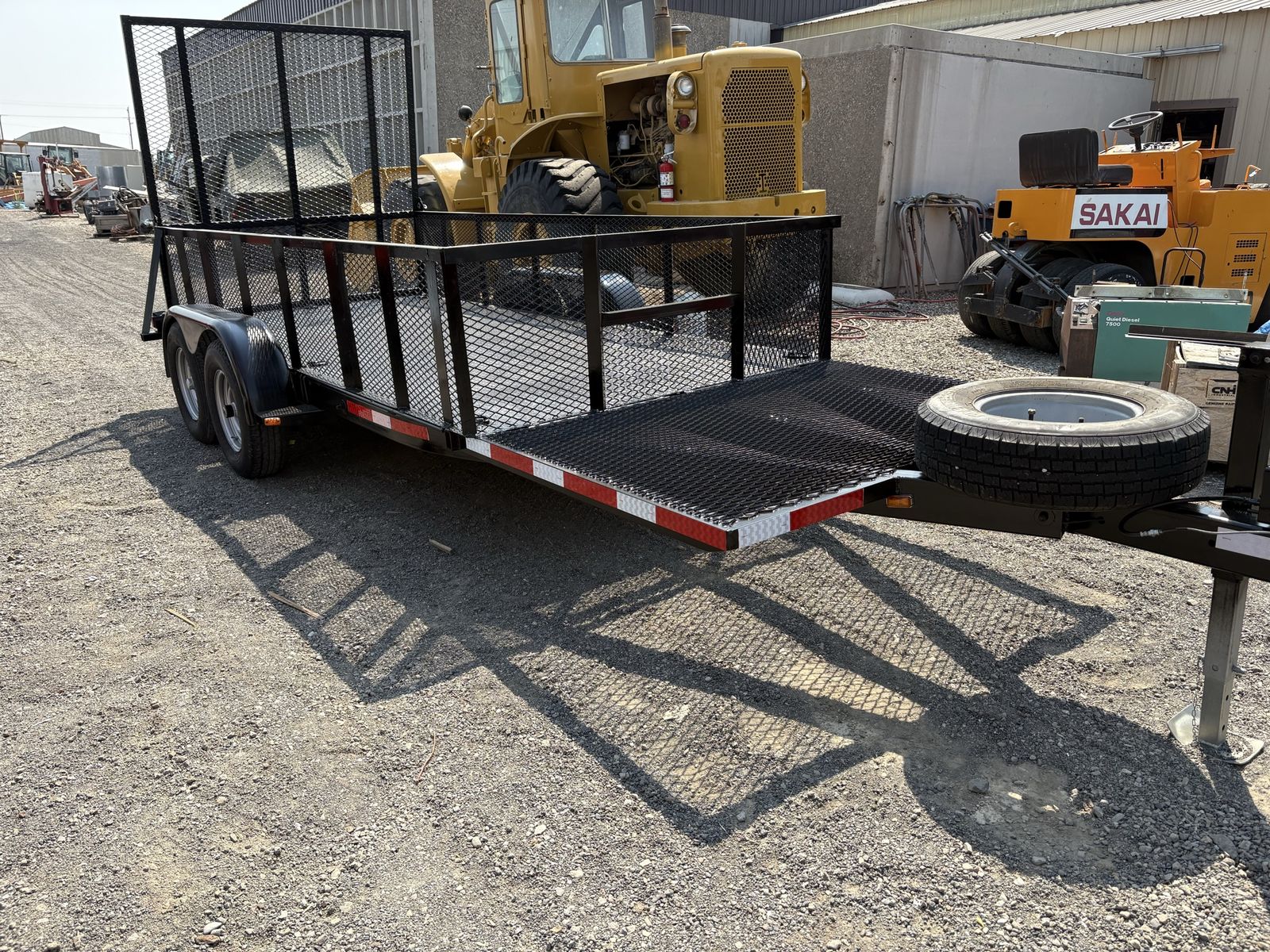 Heavy Duty Dual Axle Utility Trailer with Rear Ramp and Spare Tire.  