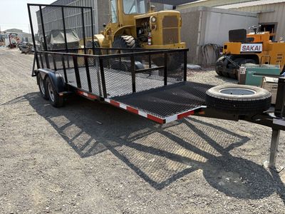 Heavy Duty Dual Axle Utility Trailer with Rear Ramp and Spare Tire.