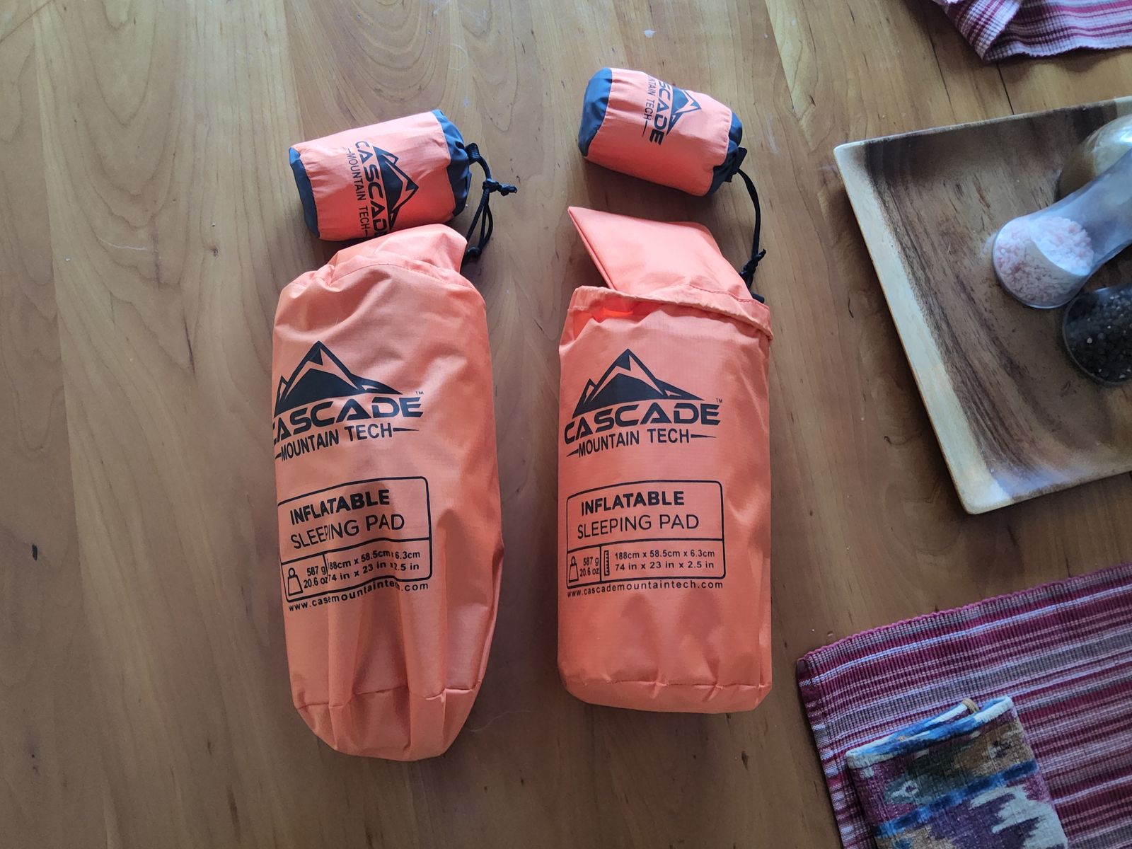 Pair of new camp mattresses with pillows.