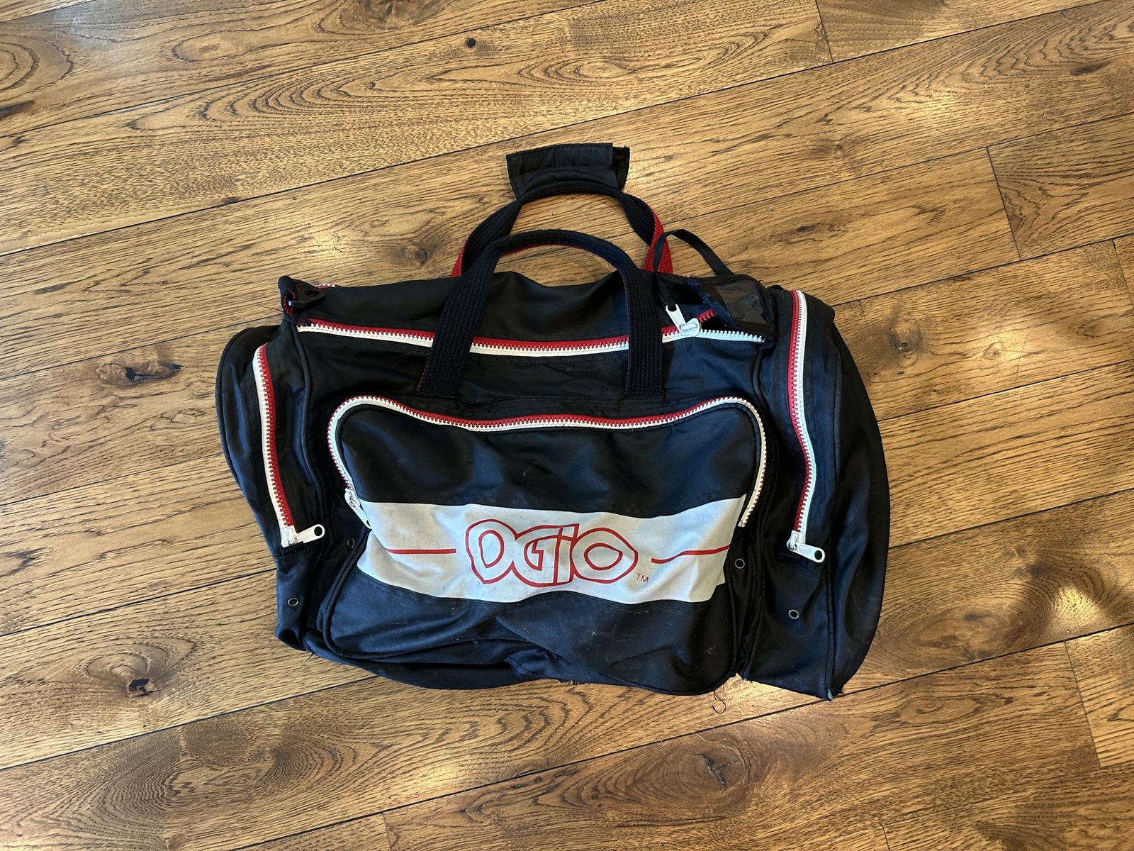 OGIO Black and Red Duffel Gear Bag with Multiple Zipper Pockets