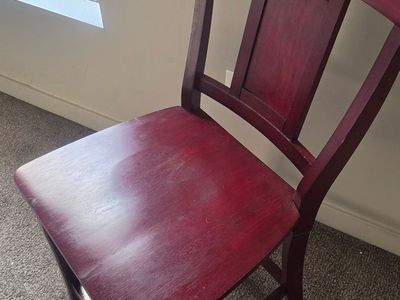 Four Red wood chairs
