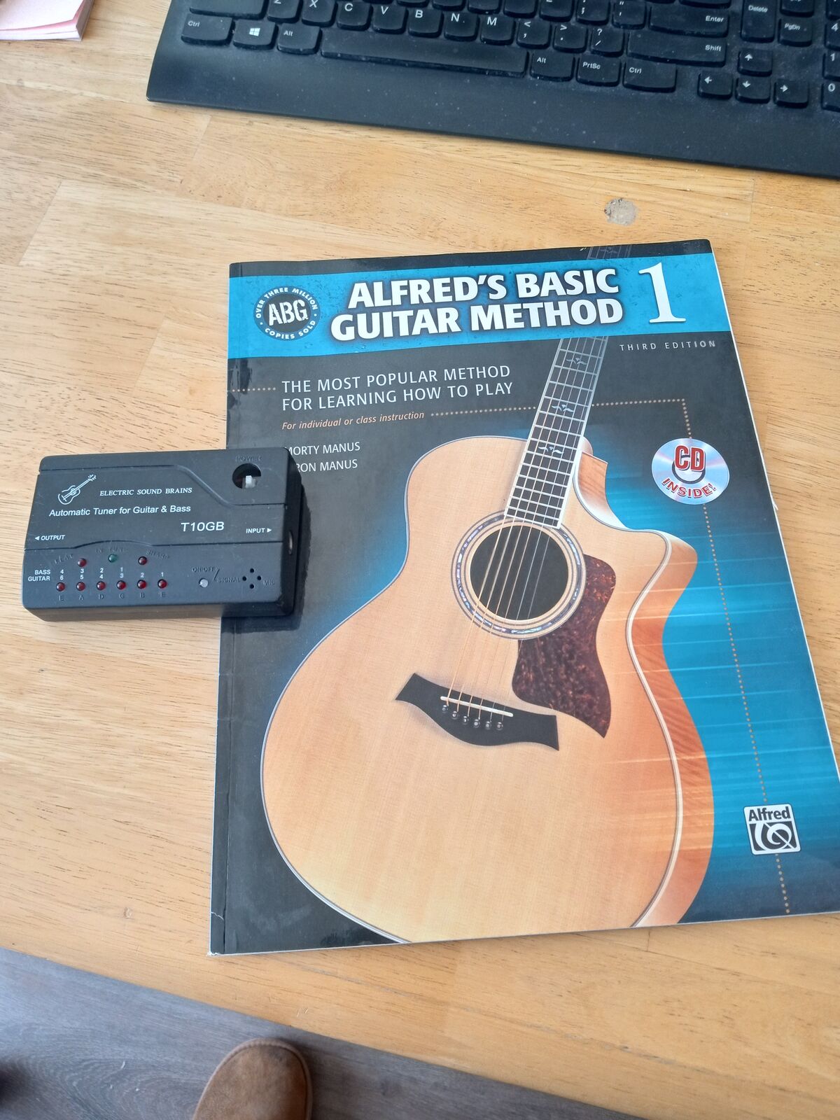 Alfred's Method Guitar book and guitar tuner