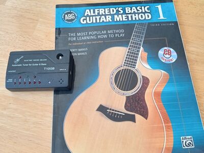 Alfred's Method Guitar book and guitar tuner