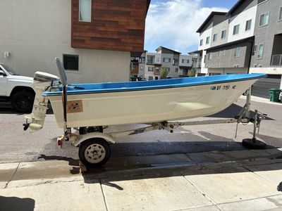 1986 14’ Livingston Boat with Johnson 15 Outboard Motor and Trailer