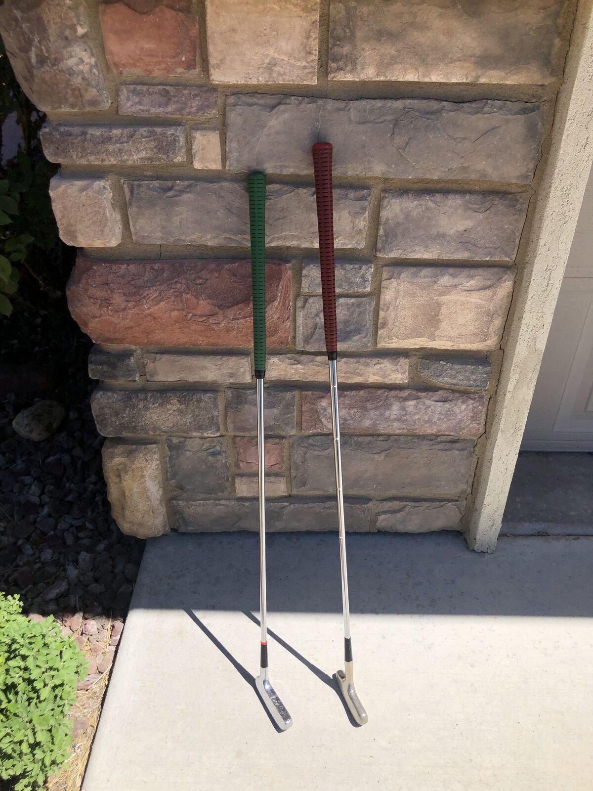 2 Pre-Owned Putters - solid heads    Northwestern 4 Star Green Grip and Putt Putt Red Grip