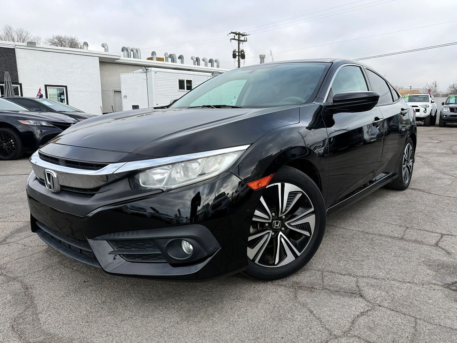 2017 Honda Civic EX-L w/Navi — rebuilt & branded title, 26% below market