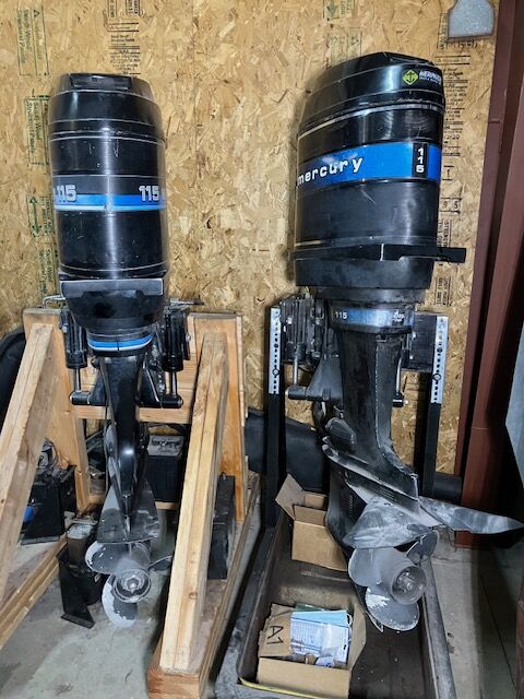 Two Mercury 115 hp outboard boat motors
