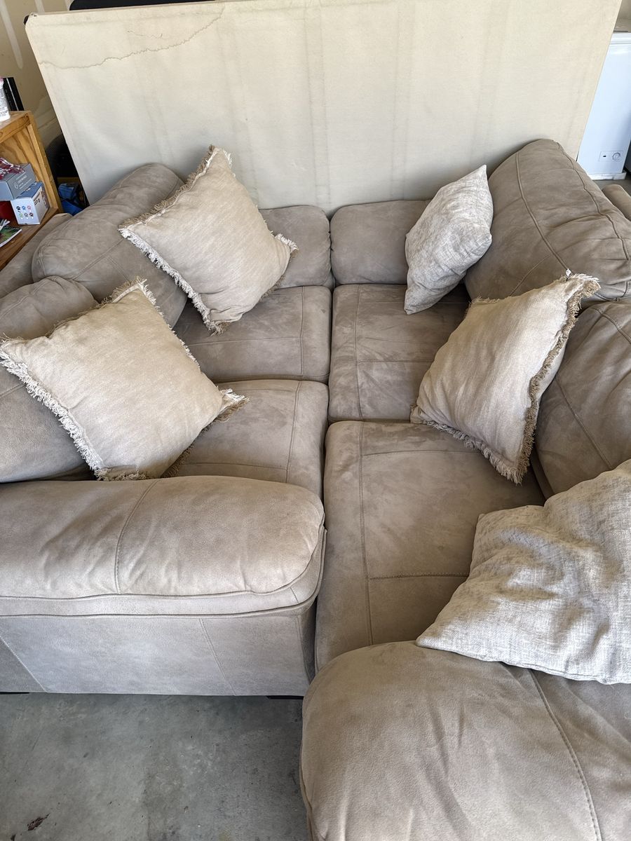 Large Beige Sectional Couch with Accent Pillows