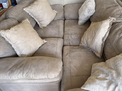 Large Beige Sectional Couch with Accent Pillows