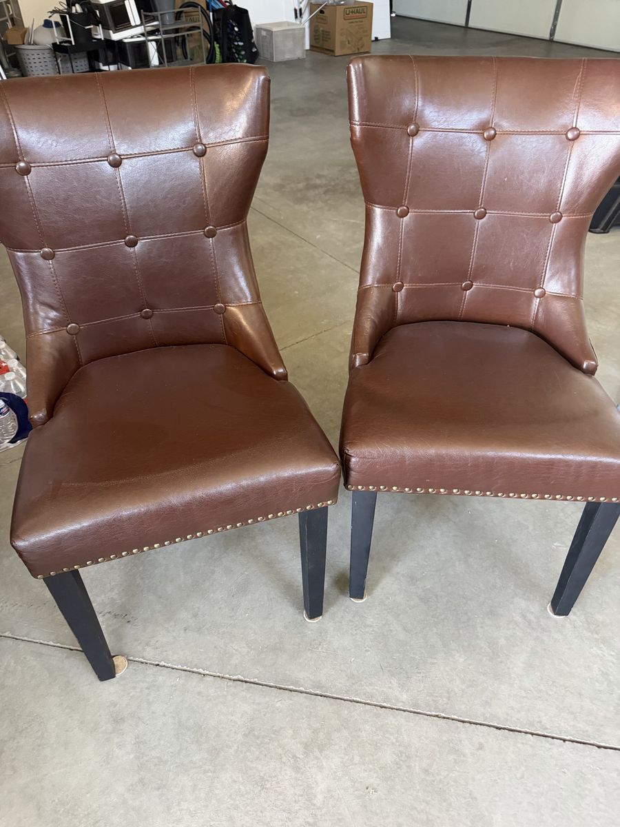 Pair of Tufted Brown Faux Leather Dining Chairs with Nailhead Trim. $50 for pair.