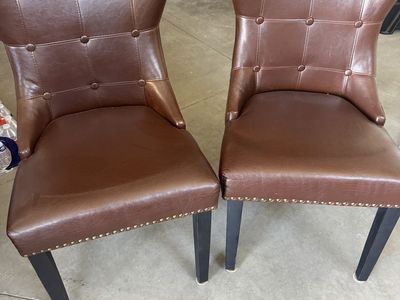 Pair of Tufted Brown Faux Leather Dining Chairs with Nailhead Trim. $50 for pair.