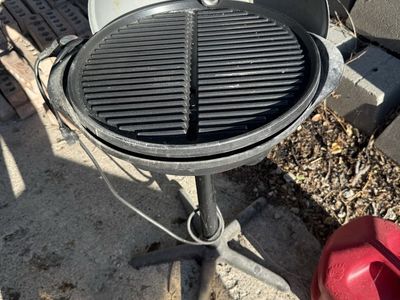George Foreman standalone electric indoor or patio grill.