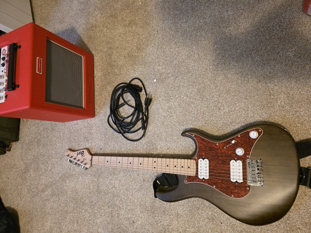 Cort G100 electric guitar and Redline reverb amp.