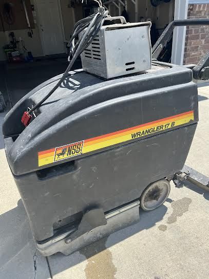 Self-propelled floor scrubber