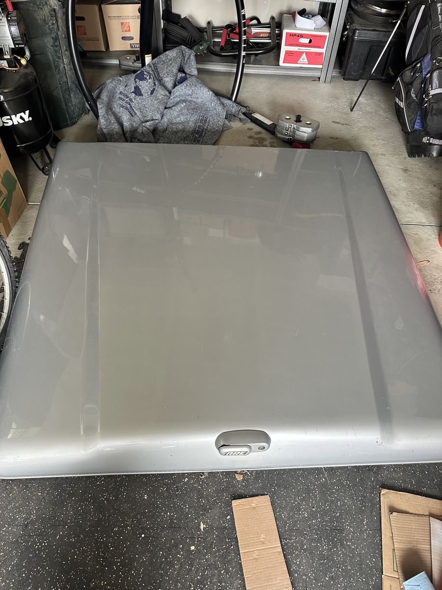 A.R.E. Truck Bed Cover - Silver (Appears to be for a Ford F-150)