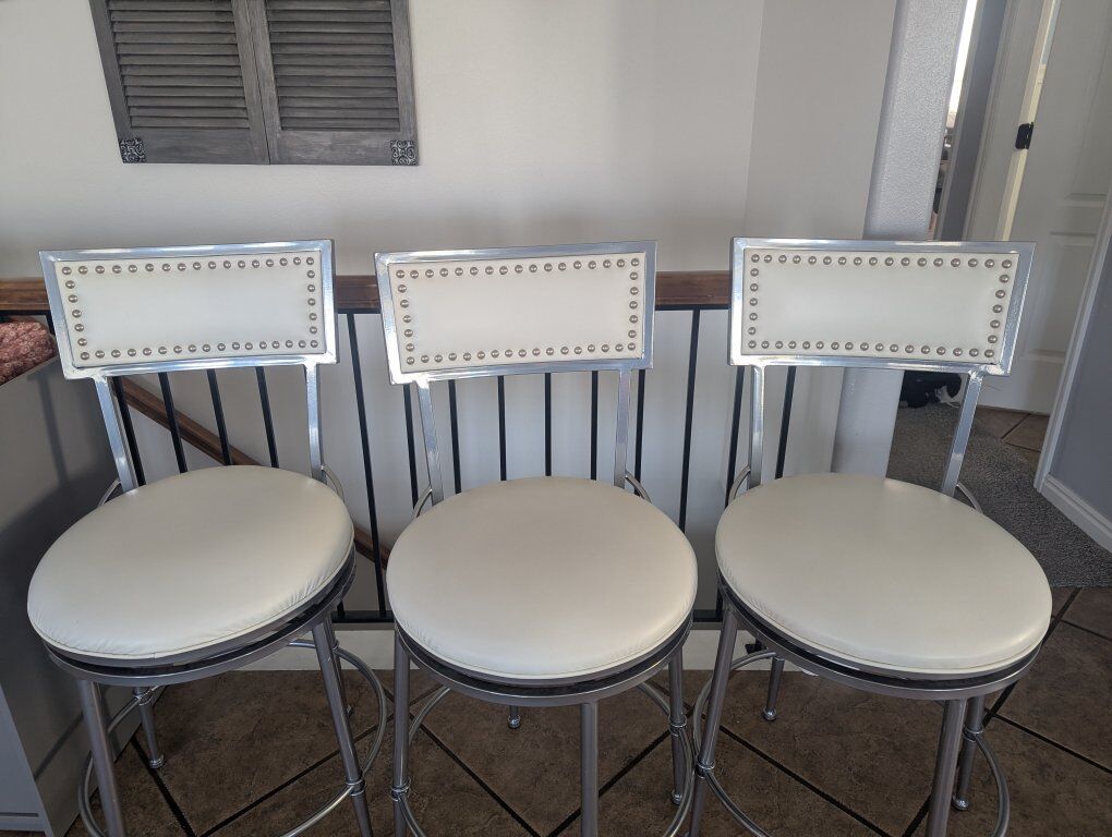 3 White Swivel Bar-height Stools