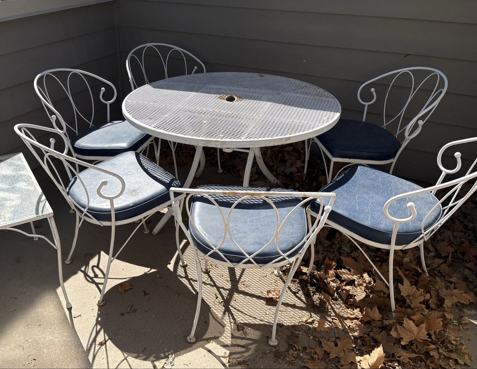 Vintage White Metal Table & 6 Chairs w/ Blue Cushions