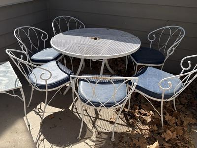 Vintage White Metal Table & 6 Chairs w/ Blue Cushions