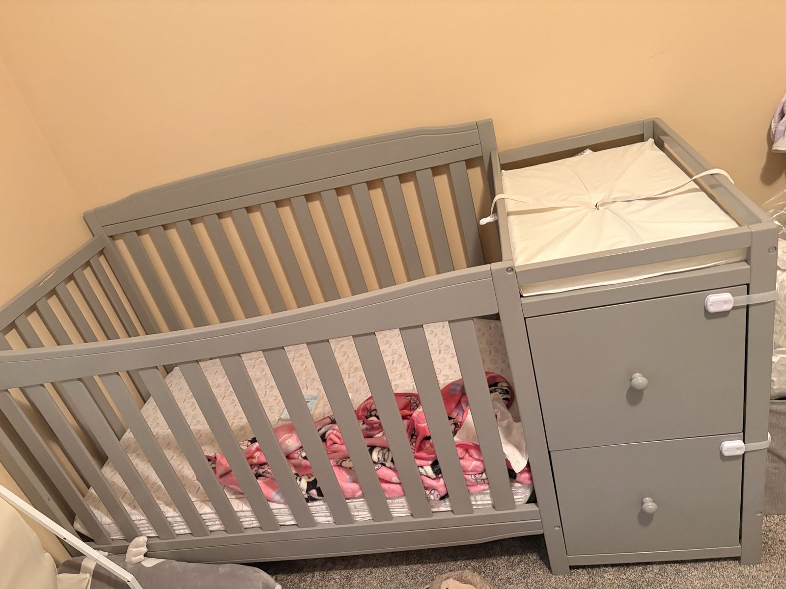 Gray Wooden Baby Crib with Attached Changing Table and Drawers Combo