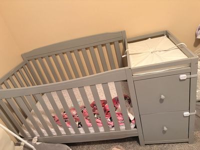 Gray Wooden Baby Crib with Attached Changing Table and Drawers Combo
