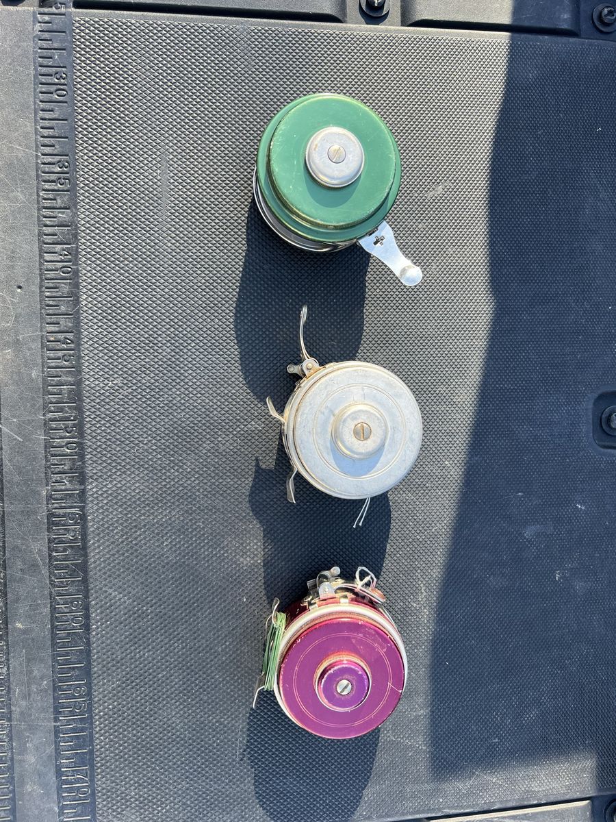 Lot of 3 Vintage Fishing Reels - Green, Silver, and Purple Automatic Fly Reels