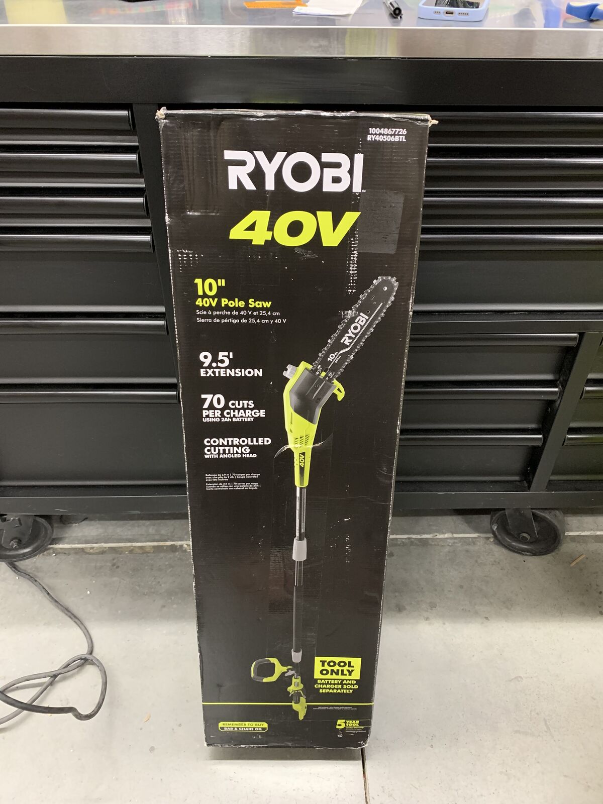 RYOBI 40V 10 in. Cordless Battery Pole Saw, Bar and Chain Oil with Extra Chain
