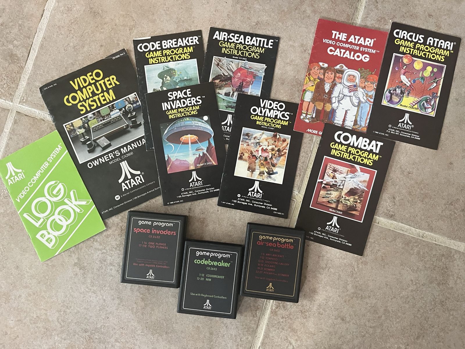 Collection of old Atari games and booklets air sea battle codebreaker space invaders all $35