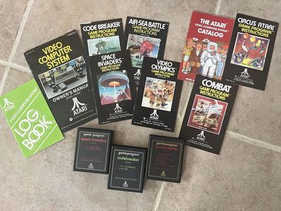 Collection of old Atari games and booklets air sea battle codebreaker space invaders all $35
