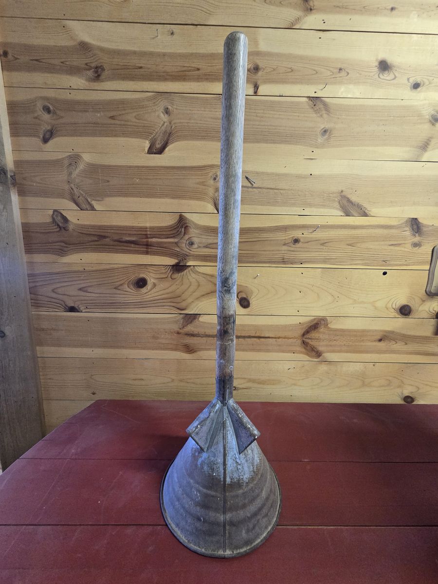 antique manual laundry plunger
